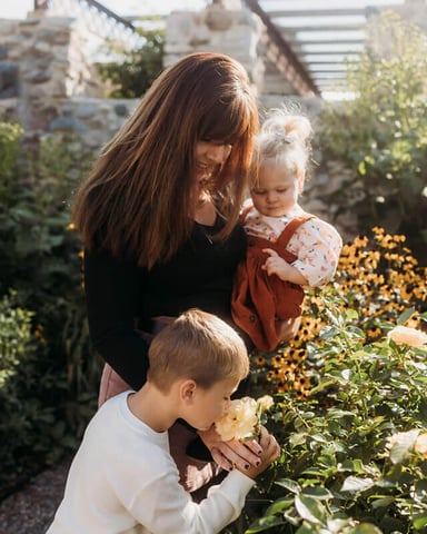 Meg, founder of Forever North, with her children in a garden